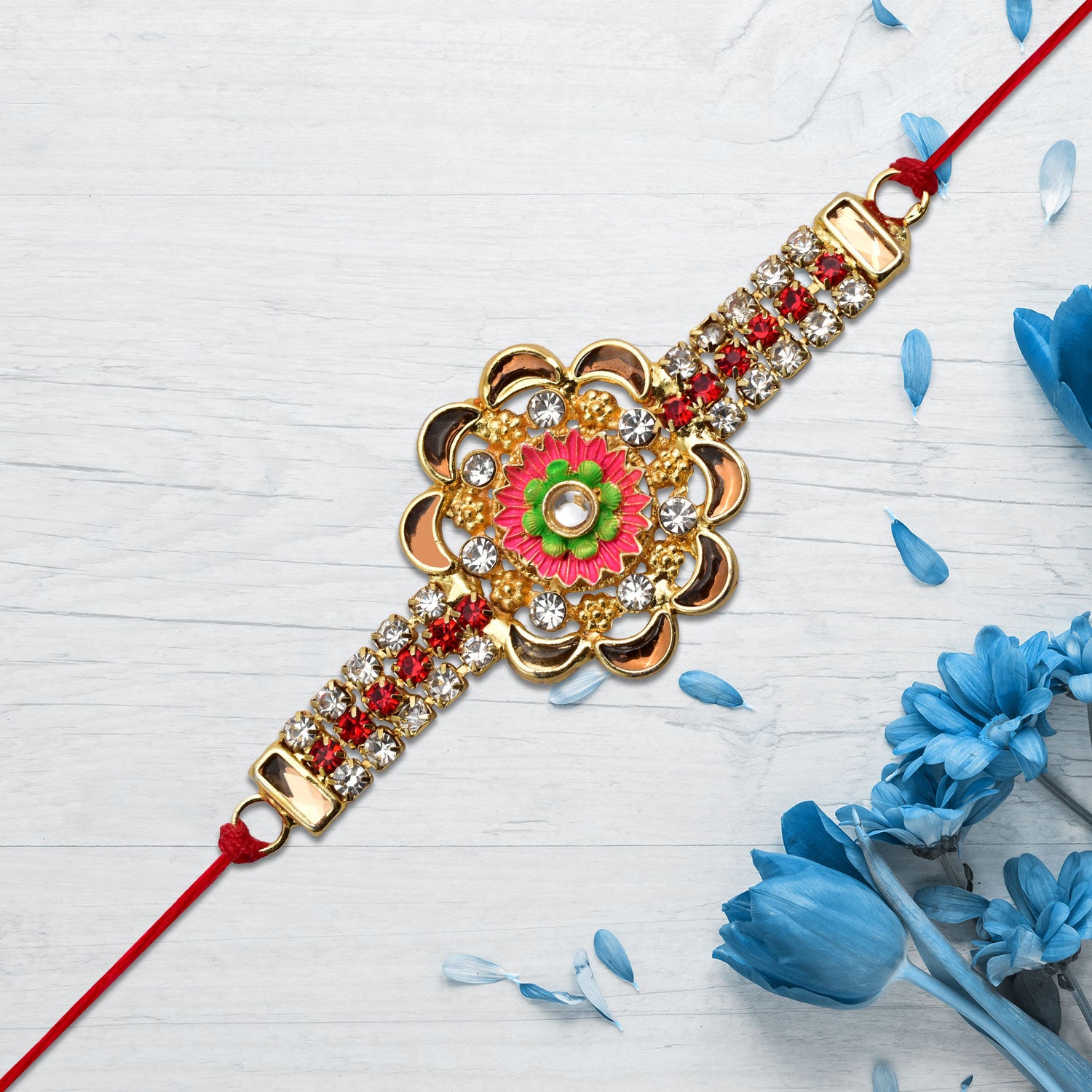 Stone Studded Floral Rakhi With Colorful Enamel Center Stone Studded Floral Rakhi With Colorful Enamel Center
